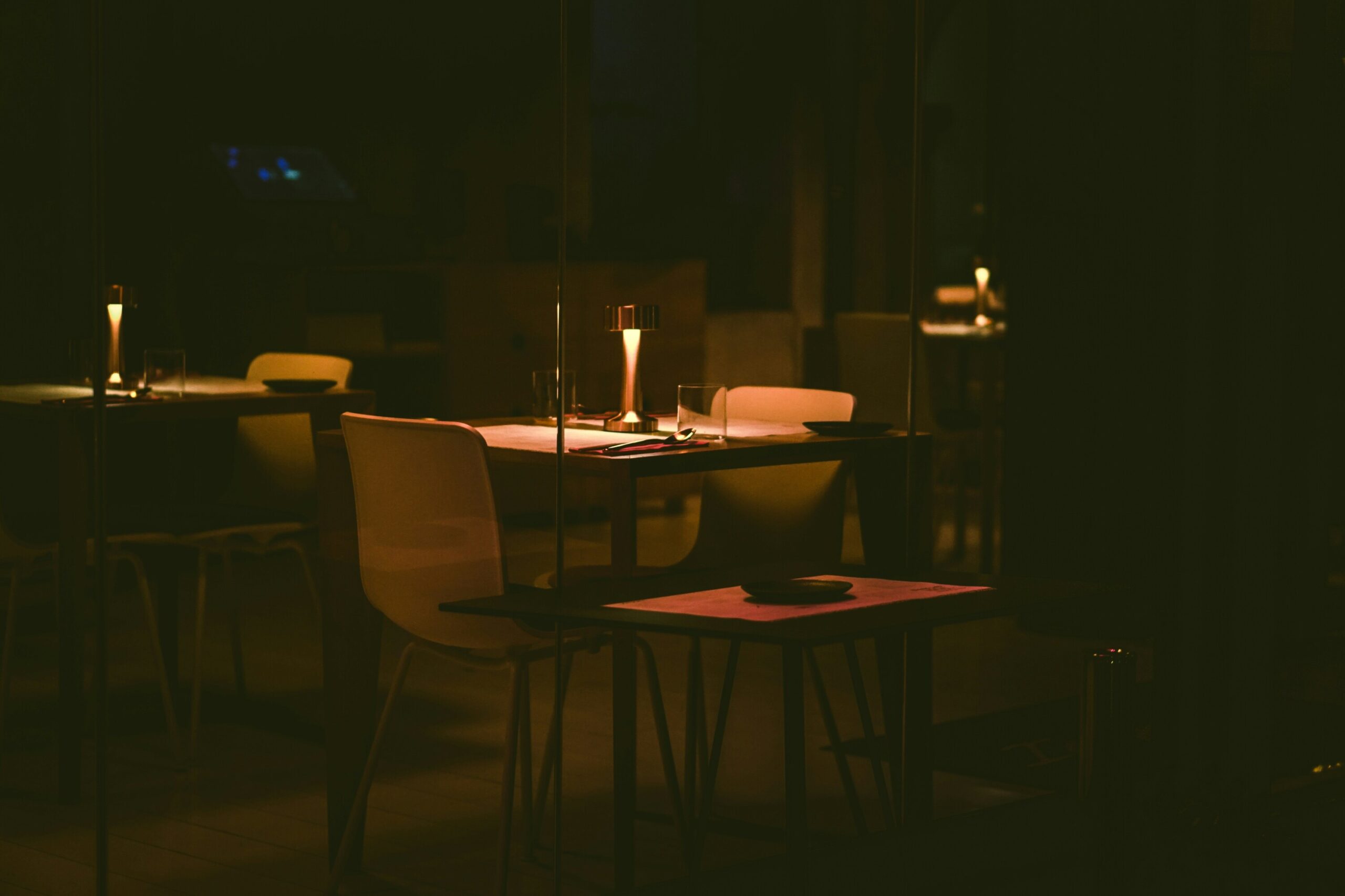 Secret Supper Clubs: Stylish supper club interior with neatly set tables ready for an exclusive dining experience.