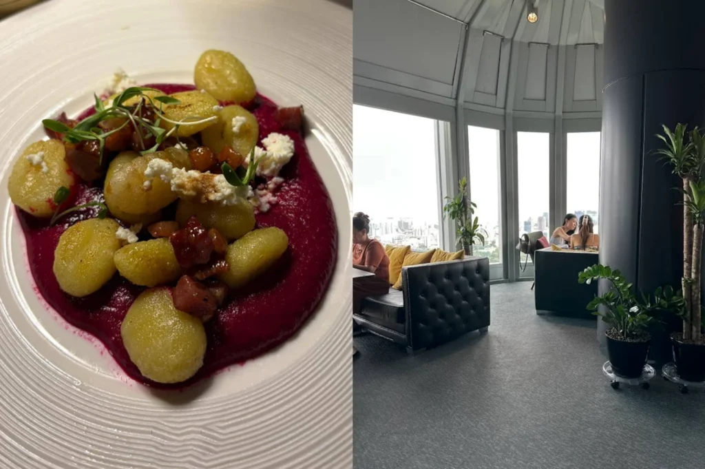 A side-by-side comparison of a dish and its setting. On the left, a high-angle shot shows several pan-seared gnocchi arranged over a vibrant, deep-purple beet purée, topped with crumbles of white goat cheese and micro-greens. On the right, a wide-angle view of a high-altitude, minimalist lounge with curved floor-to-ceiling windows. The room features grey carpeting, black tufted leather sofas, and a hazy daytime view of a sprawling urban landscape.