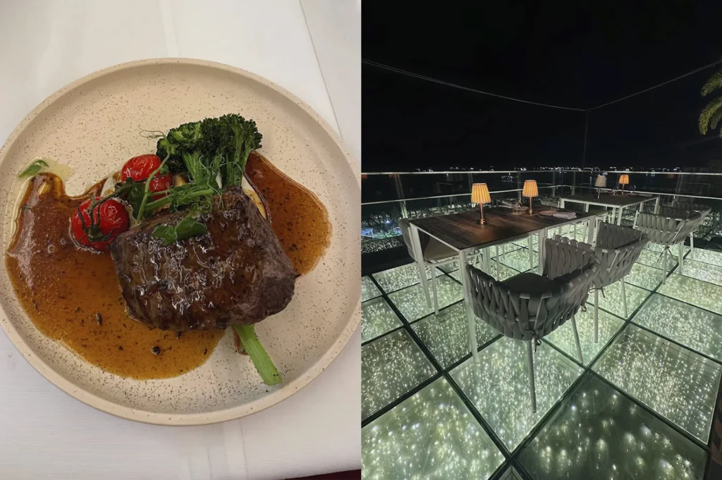 This split-screen image showcases a high-end dining experience. The left side features a top-down view of a thick, seared beef tenderloin drizzled in a rich, glossy brown jus. It is accompanied by bright red vine-ripened tomatoes, charred broccolini, and a delicate garnish of microgreens, all served on a speckled cream-colored plate. The right side captures an outdoor rooftop patio at night, where the floor is composed of glowing glass panels filled with fairy lights. Modern white tables with warm, pleated lamps are paired with stylish grey woven chairs, offering a sophisticated view of a distant city skyline under a dark sky.