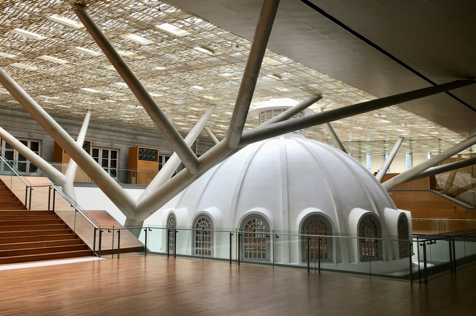 A large white dome adorned with numerous branches, featured as a top photo location at the National Gallery Singapore.