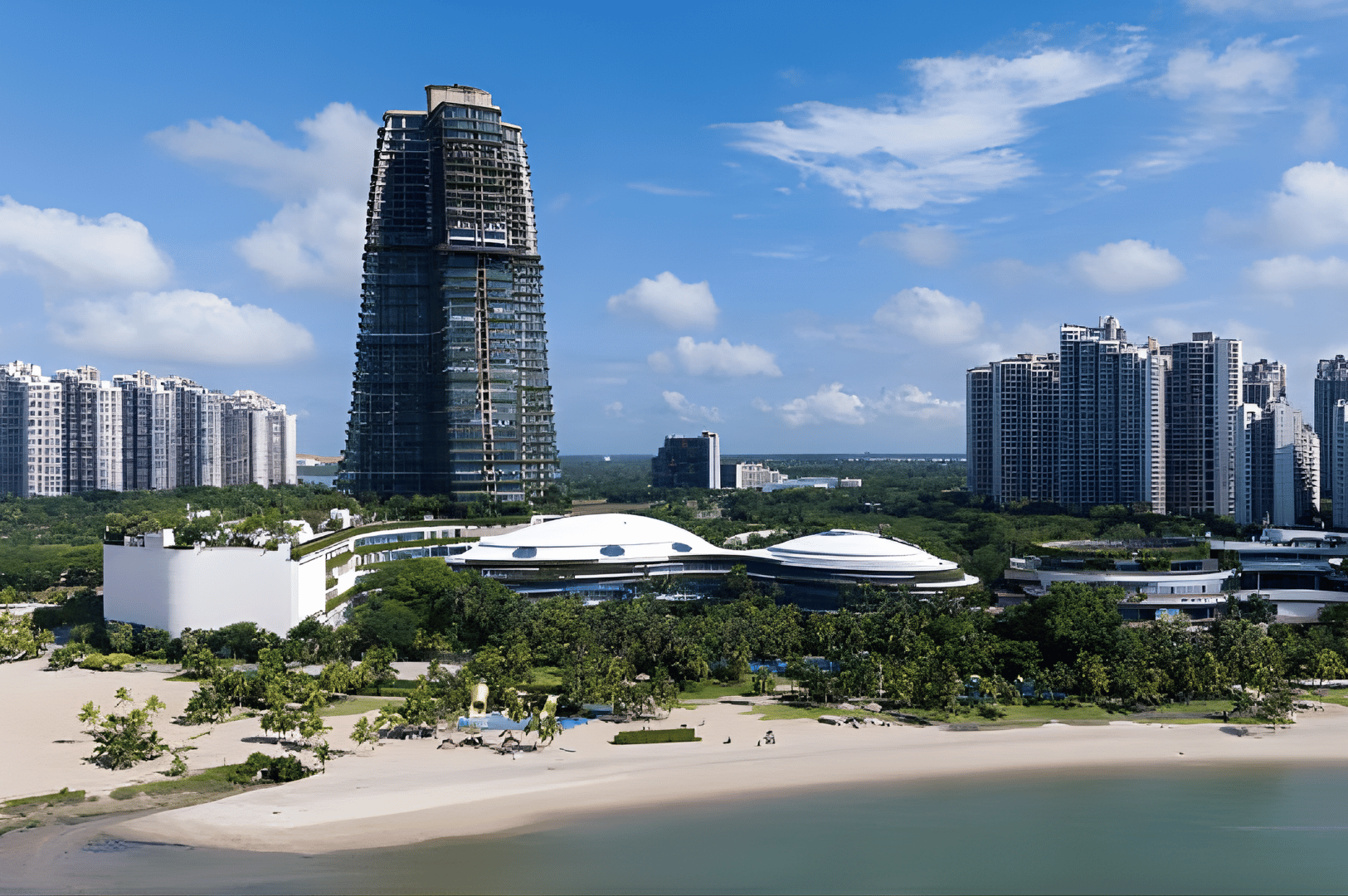 Modern beachfront skyline of Johor Bahru featuring lush greenery, contemporary high-rises, and a distinctive tapered skyscraper—capturing the city’s blend of nature, architecture, and evolving cultural appeal.