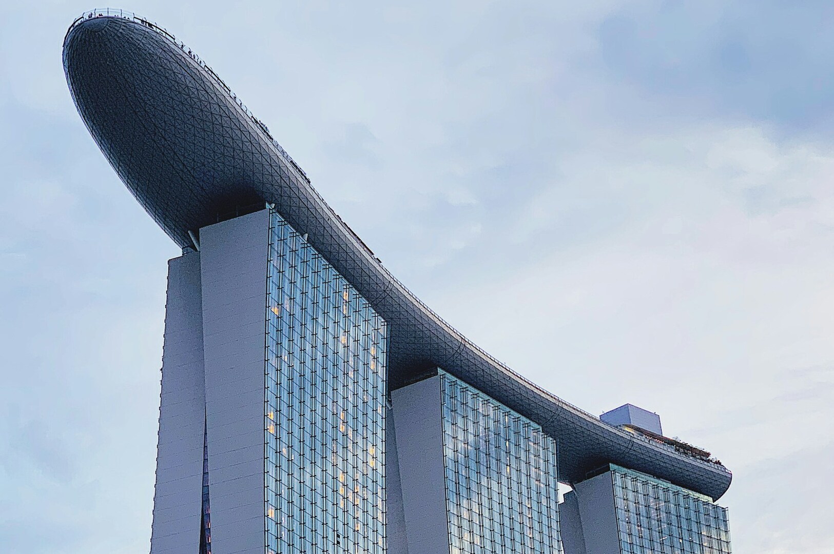 Marina Bay Sands hotel showcasing luxury accommodations with its iconic three-tower design and rooftop infinity pool.