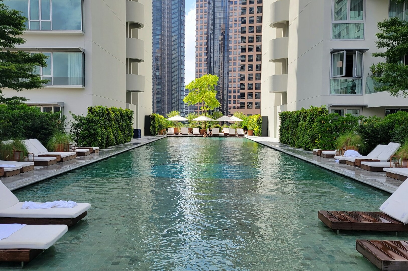 A serene view of a private pool, showcasing its elegant design and tranquil atmosphere for guests.