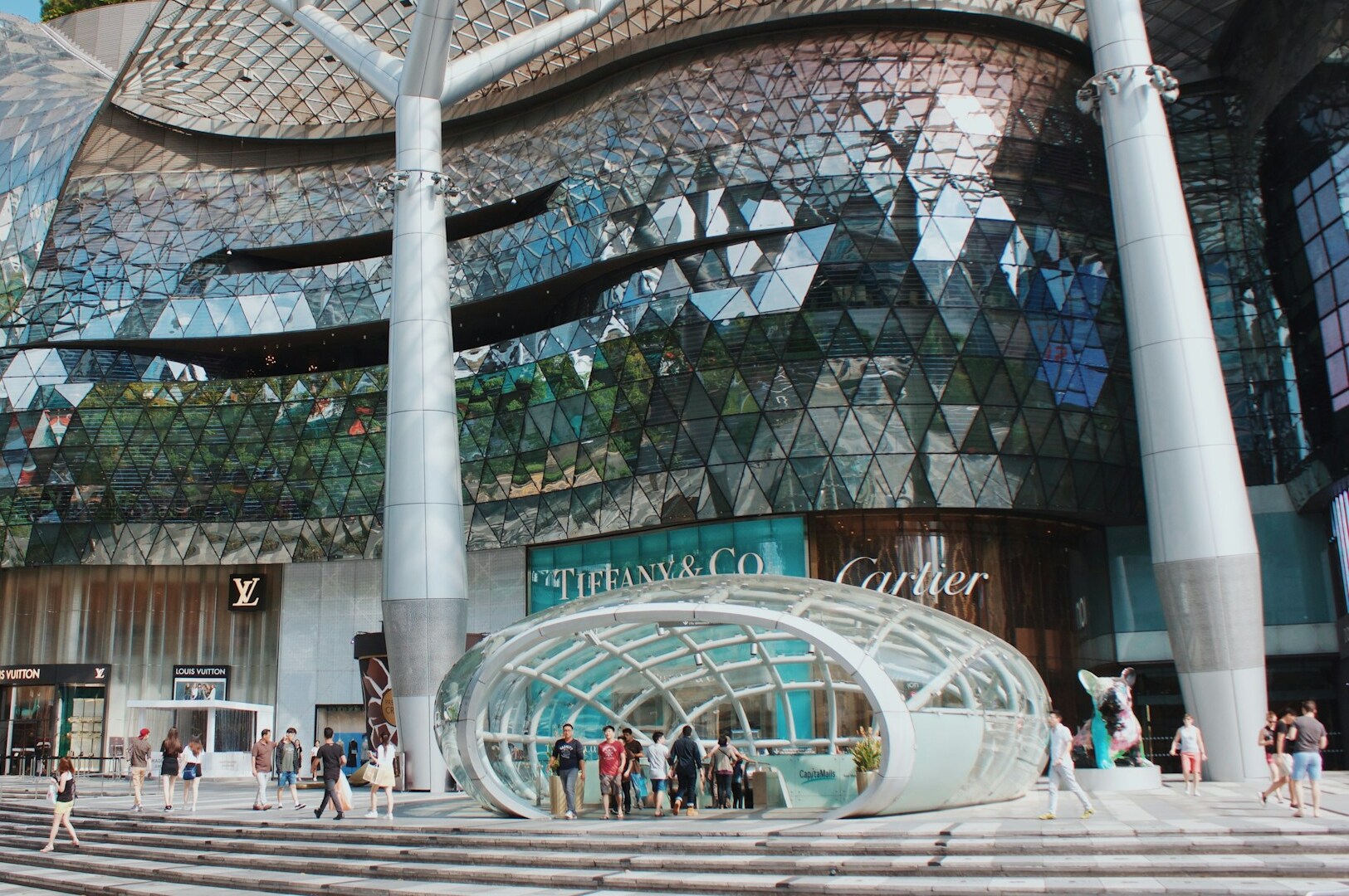 The contemporary structure on Orchard Road showcases a prominent glass facade, enhancing its sleek architectural design.