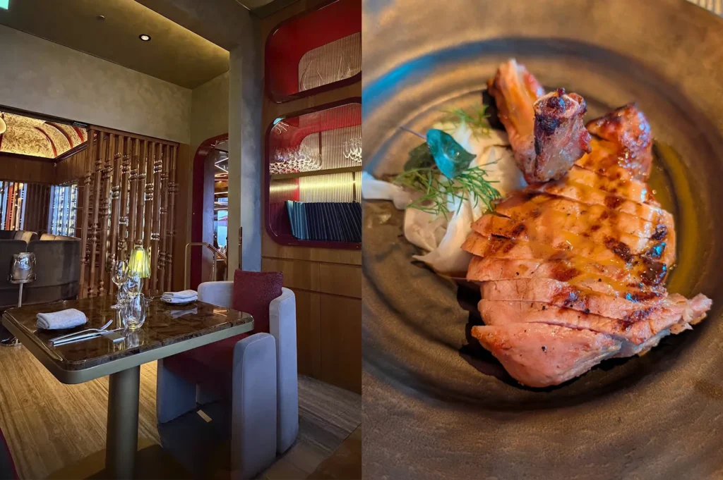 A split-view image depicting a warm, contemporary dining environment. The left side features a dark marble table and grey velvet armchairs set against a backdrop of decorative wooden screens and recessed red shelving. On the right, a top-down view of a grilled, sliced cutlet (likely pork or veal) glistening with a light glaze and served in a dark stoneware bowl with a side of shaved fennel and fresh dill.