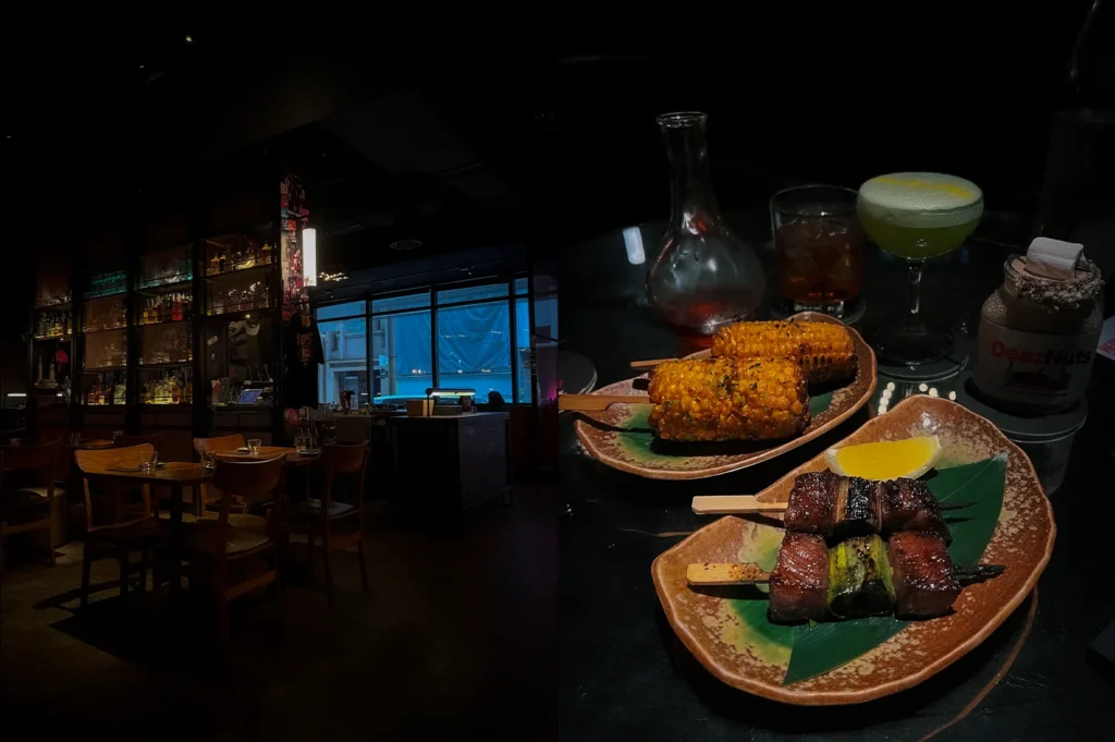 Side-by-side photos of Neon Pigeon Singapore featuring a dark modern Japanese izakaya bar interior with moody lighting and grilled skewers with roasted corn served alongside cocktails in a contemporary dining setting